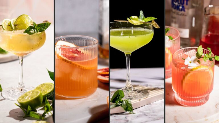 Four cocktails perfect for your Spring Refresh bar cart: a lime-garnished drink in a stemmed glass, grapefruit in a ribbed glass, green with mint in a coupe glass, and pink with lime and mint.