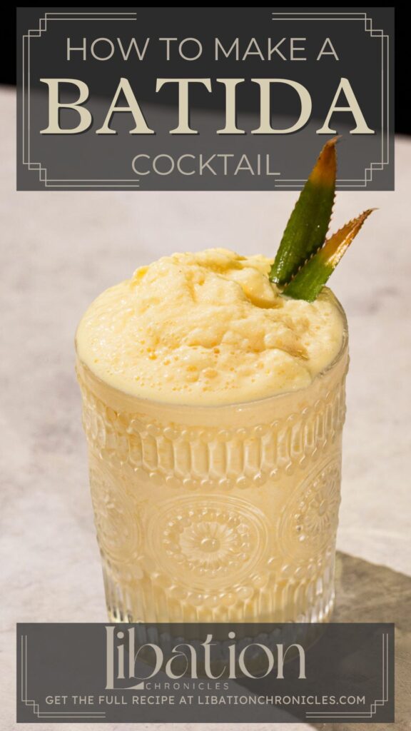 Creamy yellow Batida cocktail with pineapple leaf garnish in a textured glass on a light surface; text reads "How to Make a Batida Cocktail.