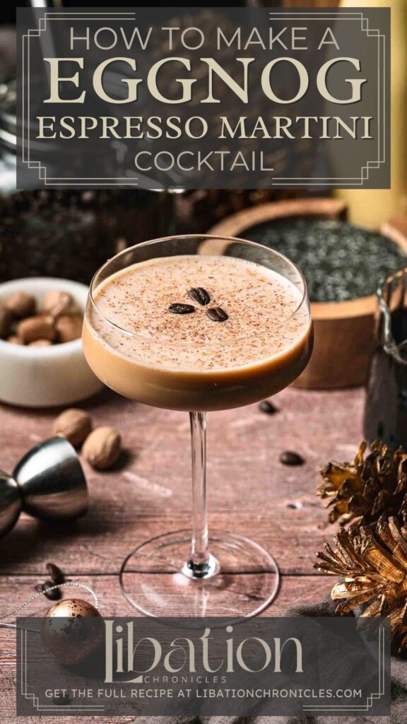 Eggnog espresso martini with coffee beans sits on wood, surrounded by cocktail tools and spices in the background.